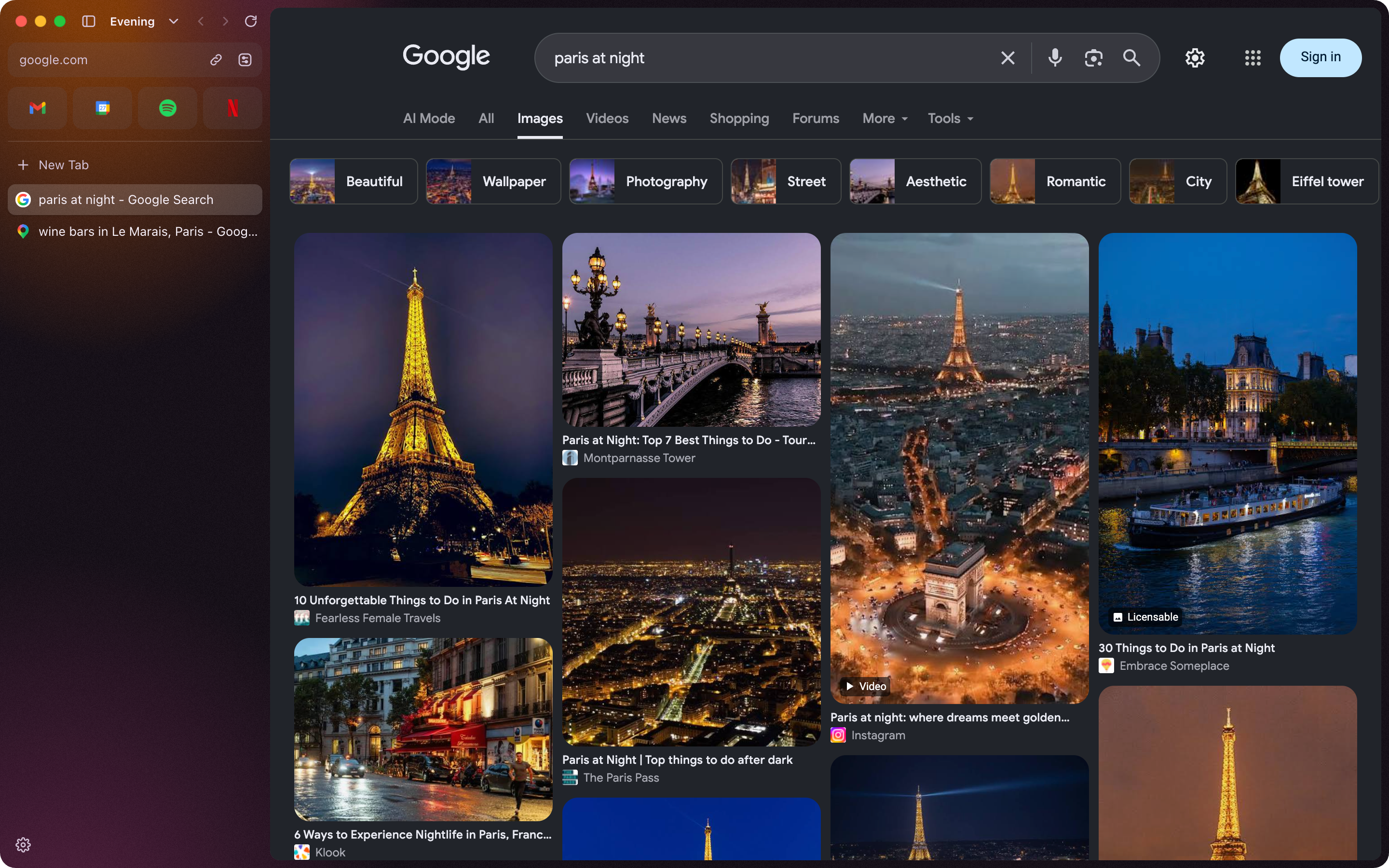 An Evening space in dark orange, with Google Images showing Paris at night, in dark mode.